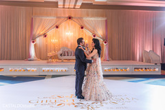 Sweet Indian couple having their first dance. Sweet Indian couple having their first dance.