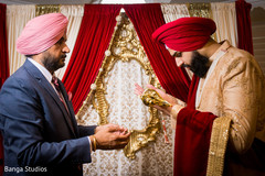 Indian groom receiving the kirpan Indian groom receiving the kirpan
