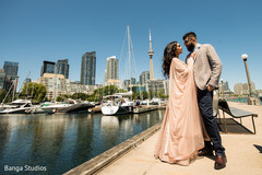 Indian couple posing outside for the photo shoot Indian couple posing outside for the photo shoot