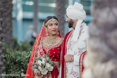 Indian bride and groom staring at each other Indian bride and groom staring at each other