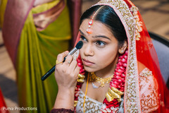 Indian bride getting her last touch ups. Indian bride getting her last touch ups.