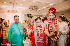Indian bride throws rice behind her Indian bride throws rice behind her