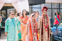 Joyful Indian couple walking out of ceremony. Joyful Indian couple walking out of ceremony.