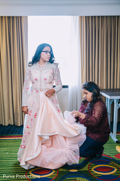 Maharani getting help with her reception outfit. Maharani getting help with her reception outfit.