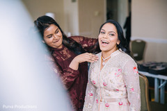 Joyful Indian bride getting ready for her reception party. Joyful Indian bride getting ready for her reception party.