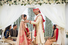 Indian groom putting garland to bride ritual. Indian groom putting garland to bride ritual.