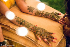 Indian bride getting her mehndi art done. Indian bride getting her mehndi art done.