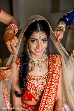 Indian bride getting her ghoonghat on. Indian bride getting her ghoonghat on.