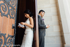 Indian couple reading the card from each other Indian couple reading the card from each other