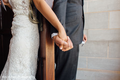 Indian bride holding Raja's hand Indian bride holding Raja's hand