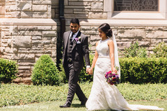 Indian bride and groom walking outdoors Indian bride and groom walking outdoors