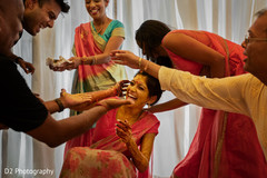 Dazzling bride getting turmeric paste all over. Dazzling bride getting turmeric paste all over.