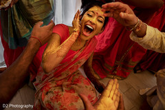 Indian bride with yellow turmeric paste Indian bride with yellow turmeric paste