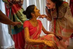 Lovely Indian bride smeared all over with turmeric paste. Lovely Indian bride smeared all over with turmeric paste.