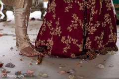 Indian couple when stepping on nuts with toes ritual. Indian couple when stepping on nuts with toes ritual.