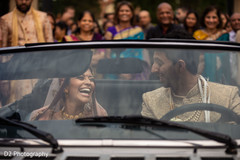 Joyful Indian couple leaving their ceremony. Joyful Indian couple leaving their ceremony.