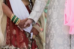 Indian groom holding the Maharani's hand Indian groom holding the Maharani's hand