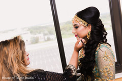 Indian bride being assisted by special guest Indian bride being assisted by special guest