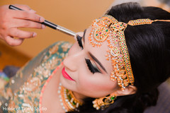Indian bride getting her makeup done Indian bride getting her makeup done