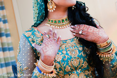 Indian bride showing her mehndi design Indian bride showing her mehndi design