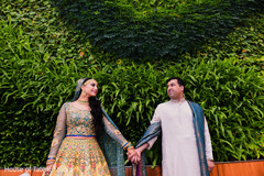 Indian bride and groom holding hands Indian bride and groom holding hands