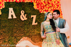 Indian couple posing by the decor Indian couple posing by the decor