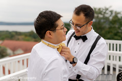 Indian groom getting his bow tie on. Indian groom getting his bow tie on.