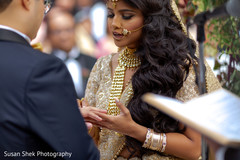 Indian bride putting ring to groom at ceremony. Indian bride putting ring to groom at ceremony.