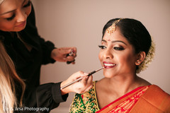 Maharani being assisted by makeup artist Maharani being assisted by makeup artist