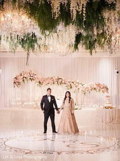 Indian bride and groom holding hands Indian bride and groom holding hands