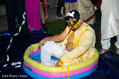 Indian groom at the pool during the pre wedding rituals Indian groom at the pool during the pre wedding rituals