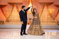 Indian bride and groom dancing for pictures Indian bride and groom dancing for pictures