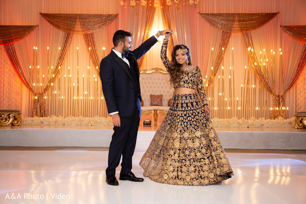Indian bride and groom dancing for pictures