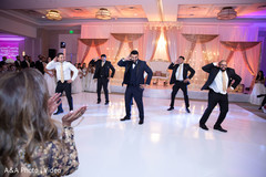 Indian groom and groomsmen performing a choreography Indian groom and groomsmen performing a choreography