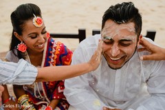 Indian groom and bride during haldi Indian groom and bride during haldi