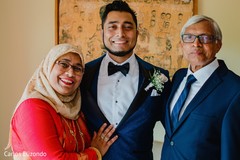 Indian groom posing with family Indian groom posing with family