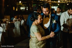 Indian groom dancing with special family guest Indian groom dancing with special family guest