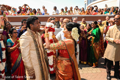 Indian bride putting garland to groom. Indian bride putting garland to groom.