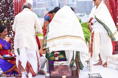 Indian couple covered with a veil at ceremony. Indian couple covered with a veil at ceremony.
