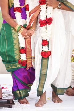Indian bride and groom holding hands at ceremony. Indian bride and groom holding hands at ceremony.