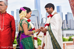 Indian bride putting ring to groom capture. Indian bride putting ring to groom capture.