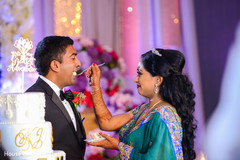 Indian bride giving cake to groom capture. Indian bride giving cake to groom capture.