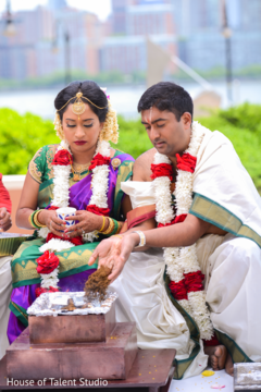 See this lovely Indian couple at their Indian wedding ceremony. See this lovely Indian couple at their Indian wedding ceremony.