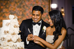 Indian bride and groom cutting the cake Indian bride and groom cutting the cake