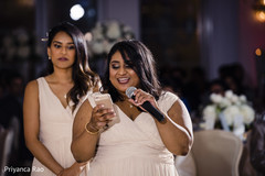 Bridesmaid delivering a message for the newlyweds Bridesmaid delivering a message for the newlyweds