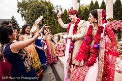 Indian groom giving money to bridesmaids to get his shoes. Indian groom giving money to bridesmaids to get his shoes.