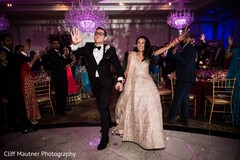 Indian couple making their entrance to reception party. Indian couple making their entrance to reception party.