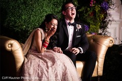 Cheerful Indian bride and groom at reception speech. Cheerful Indian bride and groom at reception speech.