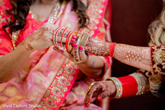 Indian bride being assisted by special guest Indian bride being assisted by special guest