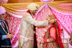 Indian groom placing the garland on the Maharani Indian groom placing the garland on the Maharani